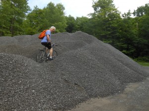 Mark climbing a gravel mountain